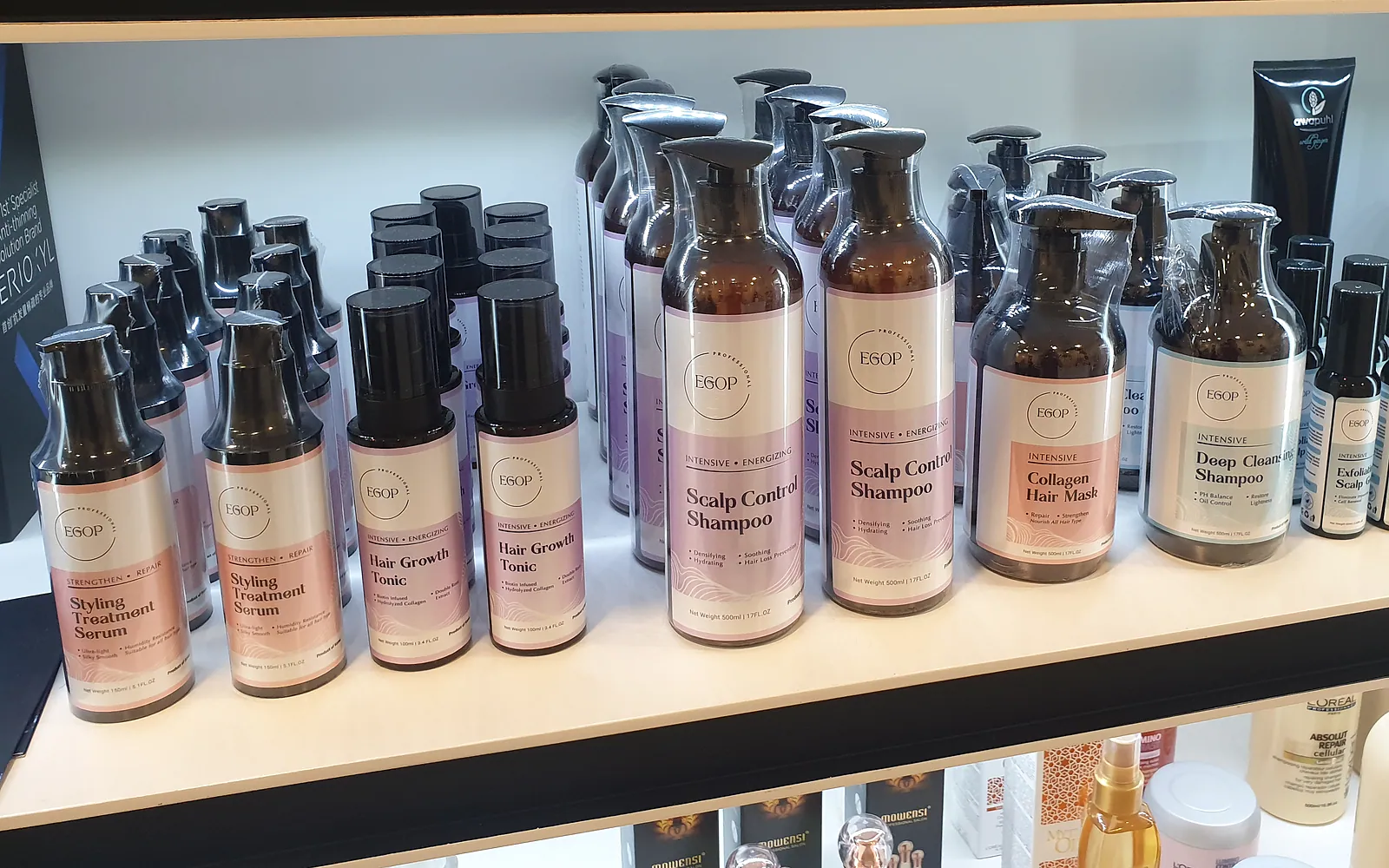 Printed EGOP product labels applied across a hair care product range