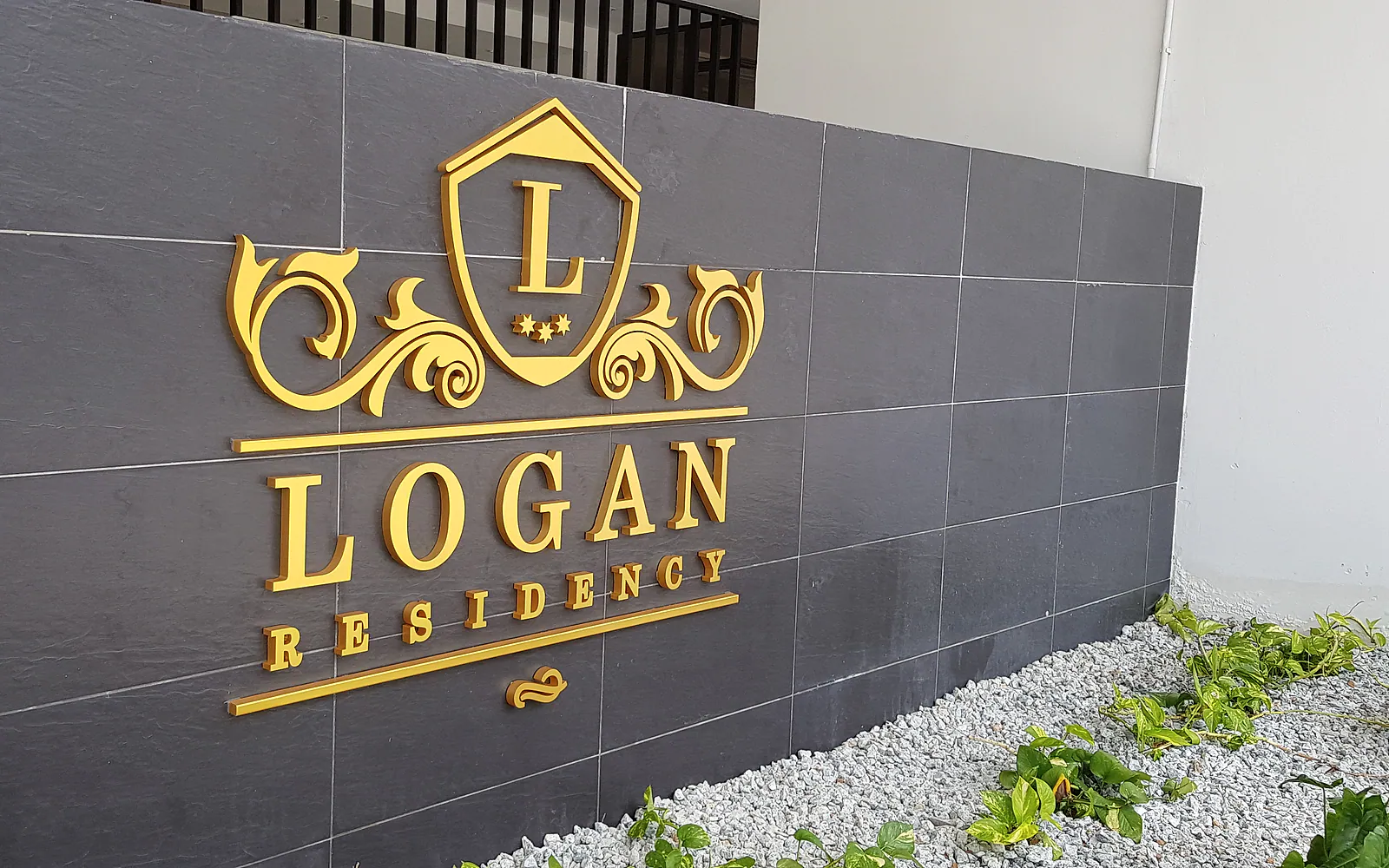 Close view of gold dimensional lettering for Logan Residency by Jprint Studio