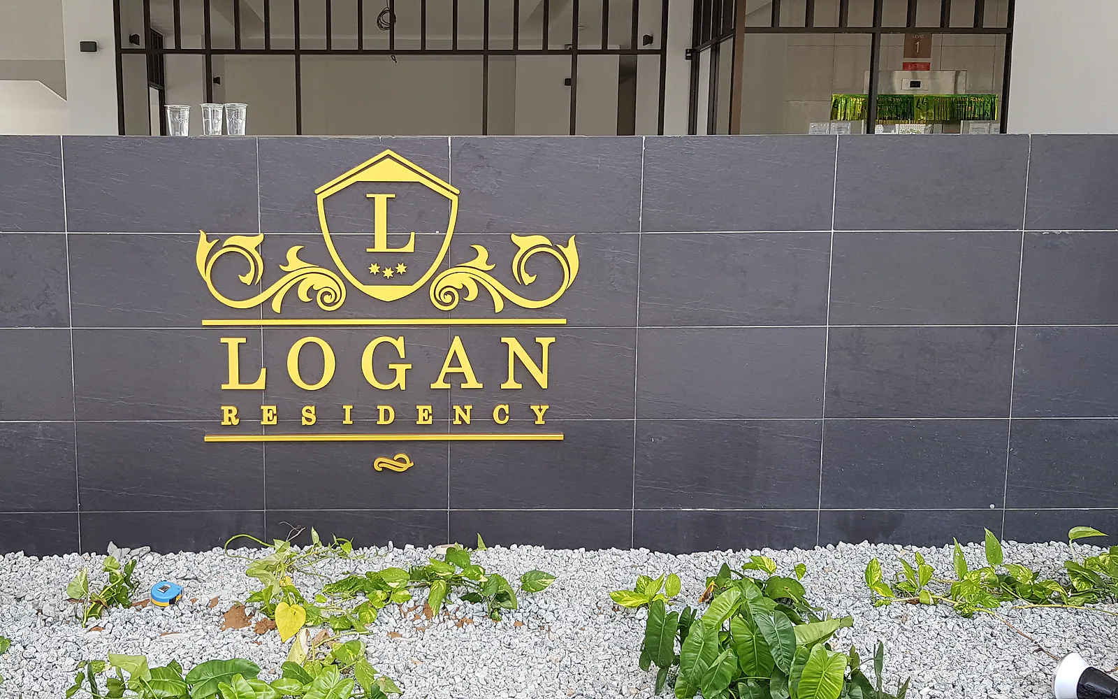 Logan Residency dimensional wall sign produced and installed by Jprint Studio